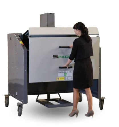 Operator loading suitable waste into a compatible commercial bin